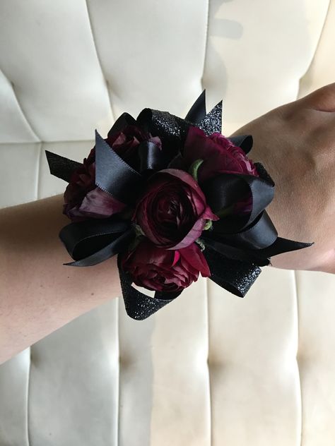 Pomp&Bloom dark burgundy and black corsage Red Black Corsage, Prom Corsage And Boutonniere Burgundy, Red And Black Wrist Corsage Prom, Black And Maroon Corsage, Corsages For Prom Burgundy, Emo Corsage, Gothic Corsage Prom, Burgundy Corsage Prom, Dark Red Corsage And Boutonniere