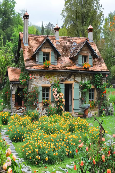 Rustic cottage with colorful garden in full bloom in a French garden. Cottage Home With Garden, Cozy Home Garden, Cottage Garden Photos, Cottage House Designs Exterior, Cottage Home Garden, Whimsical Cottage Exterior, Cozy Cottage Garden, Caterpillar Reference, Rustic Cozy House