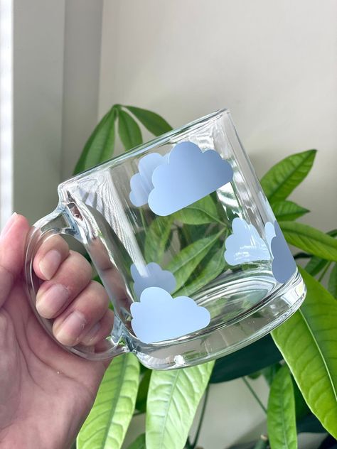 Stylish cloud glass mug with boho design. Perfect for your morning coffee or tea. #bohocup #cloudmug . #Painted_Glass_Coffee_Mugs #Glass_Drinking_Cups #Glass_Vinyl_Design #Summer_Birthday_Gift_Ideas Rain Cloud Mug, Glass Drinking Cups, Cute Cups And Mugs, Clear Mugs With Vinyl, Cute Coffee Mugs Designs, Cup Decoration Ideas, Glass Mugs With Vinyl, Cricut Glass Cups, Cute Mug Designs