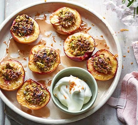 Roast pistachio-stuffed peaches with orange blossom cream Vegan Hot Cross Buns, Grilled Cabbage, Roasted Ham, Gratin Dish, Bbc Good Food, Pub Food, Creamed Spinach, Cross Buns, Bbc Good Food Recipes