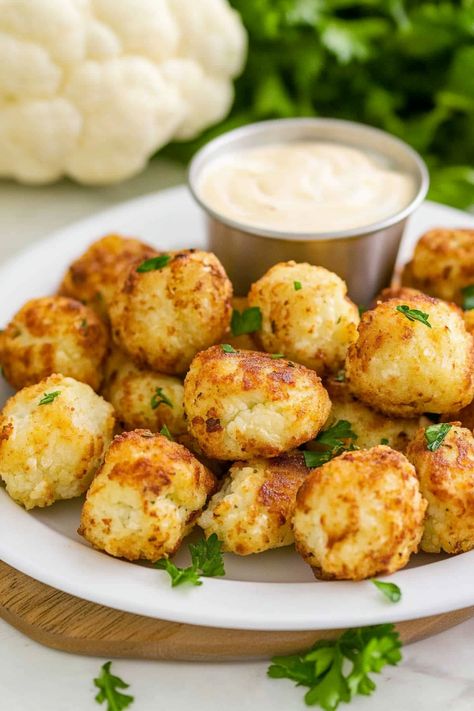 Looking for a quick and delicious snack recipe? Try making two-ingredient cottage cheese tots! These tots are easy to make and require minimal ingredients. Simply mix cottage cheese with your favorite seasoning, form into tot shapes, and bake until crispy. These flavorful tots are perfect for snacking or as a side dish. Give this simple recipe a try today!  Ingredients 1 head of cauliflower 1 cup plain cottage cheese 1/2 cup bread crumbs 1/2 cup grated parmesan cheese 1/2 teaspoon garlic powder Cottage Snacks Ideas, Cottage Cheese Tots Recipe, Low Cal Cottage Cheese Recipes, Cottage Cheese Rolls, Cottage Cheese Crisps, Cottage Cheese Tots, Cottage Cheese Garlic Bread, Baking With Cottage Cheese, Baked Cottage Cheese Chips