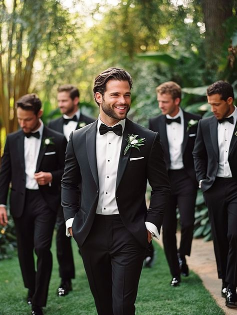 Sharp, stylish, and ready for the big day! Our groomsmen are the epitome of elegance in these perfectly tailored suits. Celebrating friendship and looking dapper every step of the way.   #GroomsmenStyle #WeddingElegance #SuitUp Black Tux Groom Grey Suit Groomsmen, Men’s Wedding Tux Black, Groomsmen All Black Suit, Grooms Man Suits Wedding Ideas, Black Suit And Tie Groomsmen, Men’s Bridal Party, Grooms Men Black Suits, Grey Suit Wedding Groom & Groomsmen Suits, Groom Classic Suit