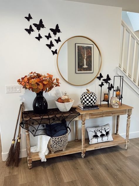 Instagram @cherish.larsen Had to spookify the entryway console table with some Halloween Decor 🎃 Links from Afloral, World Market, Mackenzie Childs, and more!! Follow my shop @cherish.larsen on the @shop.LTK app to shop this post and get my exclusive app-only content! #liketkit #LTKhome #LTKunder100 #LTKSeasonal @shop.ltk https://liketk.it/3Pk8R Mackenzie Childs Halloween, Halloween Console Table Decor, Mackenzie Childs Decor, Cherish Larsen, Halloween Entry Table, Console Decor, Console Table Decorating, Entryway Table Decor, Entryway Console Table