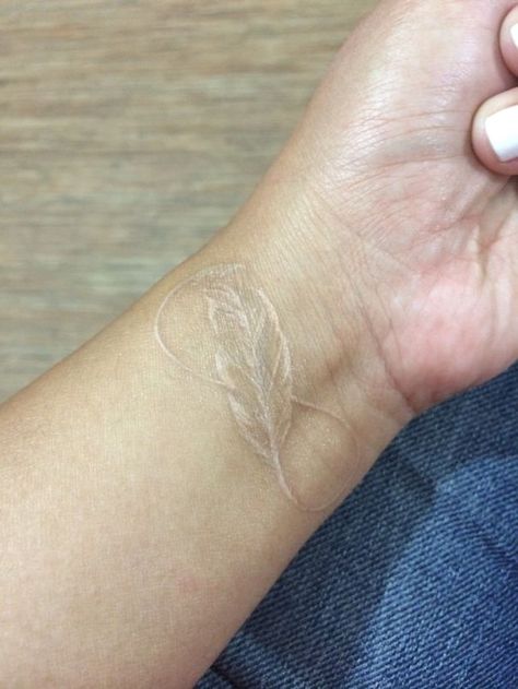 White Tattoo Of Eternity As Light As Feather Minimalist Tattoo Feather, White Feather Tattoos, Feather Tattoo Design, White Ink Tattoo, Wild Tattoo, Triangle Tattoos, Geniale Tattoos, Temp Tattoo, Modern Tattoos