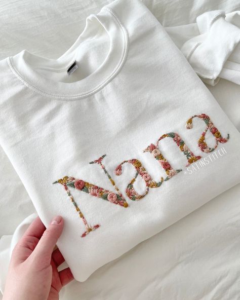 🌸 The sweetest gift, for the sweetest person in your life ✨🥹 Absolutely in love with how this order turned out! The colors are just perfect and the with sweatshirt really displays them beautifully. Mother’s day is around the corner! Would you treat your Nana with one of these? 🩷 #handembroidery #giftforgrandma #momlife #grandma #embroideredclothing #flowerembroidery #mothersdaygiftideas Hand Embroidered Letters, Sweatshirts Embroidery, Initial Sweatshirt, Gift Embroidery, Embroidery Letter, Embroidered Letters, Embroidered Initials, Floral Initial, Embroidery Tshirt