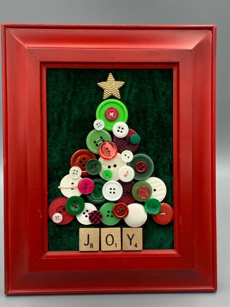 Red, green and white buttons layered to make the tree with Scrabble tile trunk, spelling joy. Framed Button Christmas Tree, Christmas Tree Ornaments With Buttons, Christmas Tree With Buttons, Button Christmas Tree Craft, Button Christmas Tree Picture, Halloween Button Art, Christmas Ornaments With Buttons, Christmas Crafts With Buttons, Button Tree Craft