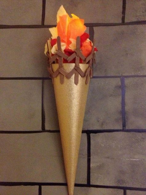 Fake Torch Diy, Diy Torch Craft, Diy Torch Prop, Keepers Of The Kingdom Vbs Decorations, Diy Torch, Keepers Of The Kingdom Vbs, Torch Craft, Medieval Decoration, Kingdom Vbs