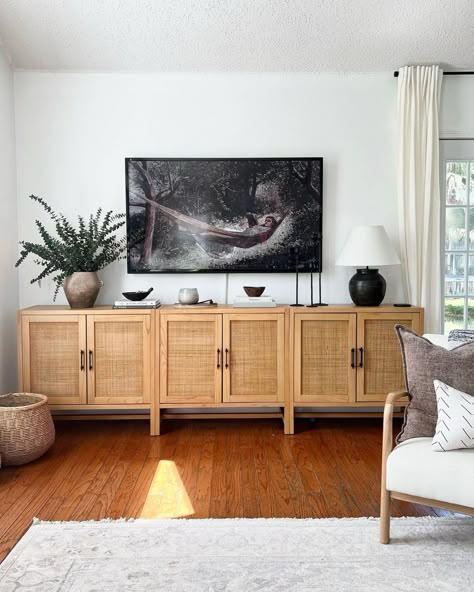 Styling Tv Stand Living Rooms, Console With Two Lamps, Wooden Tv Stand Decor, Lamps On Tv Stand, Low Tv Stand Styling, Lamps Next To Tv, Chair Next To Tv Stand, What To Put Under Mounted Tv Living Room, Living Room Media Console Bohemian