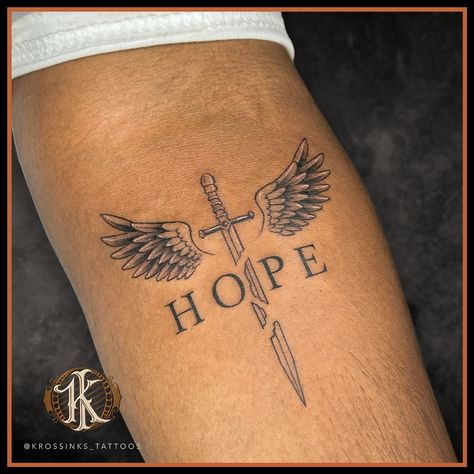 This tattoo design would carry deep meaning, with the broken sword showing past struggles, the wings indicating rising above, and hope as the unbreakable force tying it all together. . . Artist @kewal_patil92 Tattoo done at @krossinks_tattoos . . #krossinks_tattoos #tattooart #hope Meaningful Tattoo Sleeve Men, Cross Swords Tattoo Design, Tattoos Deep Meaning, Armour Of God Tattoo, Hope Tattoo Designs, Tattoo Ideas With Deep Meaning, King Of Kings Tattoo, Past Tattoo, Tattoo With Deep Meaning