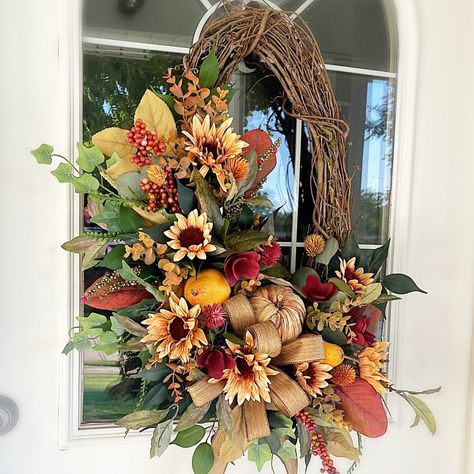 This Fall inspired Fall Oval Wreath with Sunflowers, Pears, Pumpkin and Moody Fall Floral will make the perfect Welcome Wreath addition to your home and is ready to display and enjoy! Beautiful, handcrafted and natural-looking. * 22" oval grapevine wreath base. Using only premium quality materials. * Approximate Dimensions 22"x22"x6". (see notes below) 100% satisfaction guarantee. Our wreaths make excellent gifts! If sending as a gift, message us and we will gladly include an enclosure card with a personalized message from you. Not quite ready to make a purchase? Add Brownbottle Burlap to your Favorites to make finding our shop quick and easy of future visits. **IMPORTANT PLEASE READ * Each wreath is made to order and may have some variations in the  greenery placement but we do our best t Oval Sunflower Wreath, Oval Grapevine Wreath, Oval Wreath, Elegant Fall Wreaths, Front Door Farmhouse, Fall Decor Wreaths, Fall Thanksgiving Wreaths, Door Farmhouse, Thanksgiving Wreath