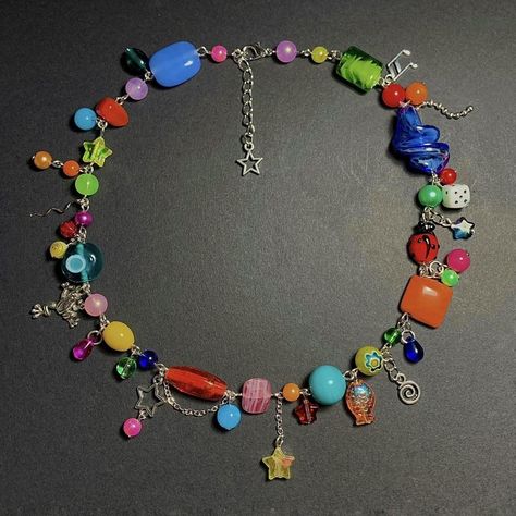 treasuringz on depop Necklace Inspiration Beads, Funky Beaded Necklace, Weirdcore Jewelry, Charm Necklace Ideas, Kidcore Necklace, Nostalgic Jewelry, Clutter Necklace, Star Charm Necklace, Indie Jewelry