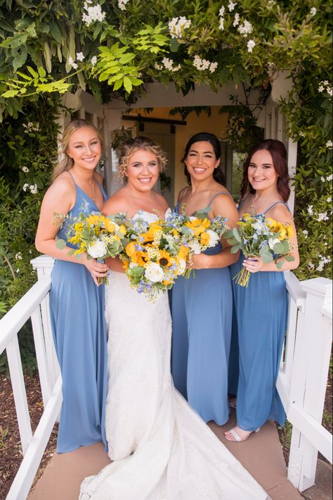 Blue And Yellow Country Wedding, Sunflower And Blue Bridal Bouquet, Dusty Blue And Sunflower Fall Wedding, Blue Wedding Theme With Sunflowers, Powder Blue And Yellow Wedding, Light Blue Sunflower Wedding, Blue Yellow Green Wedding Bridesmaid Dresses, Blue And Yellow Beach Wedding, Dusty Blue And Yellow Wedding Decor