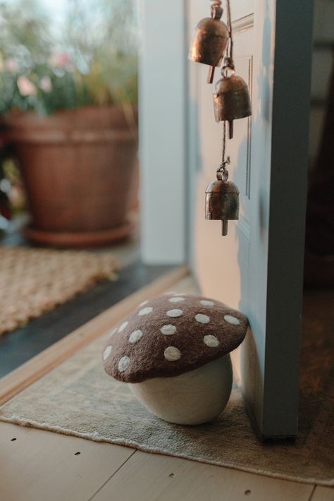 Cutie artisan felted mushroom doorstops for your home. sold individually approximate size 8” diameter at top x 6.75” h 100% wool outer, sand-filled cotton bag for weight handmade in Nepal PLEASE NOTE: each piece will have variations in design and size as this is a one-of-a-kind handmade product Fall Mushroom Decor, Giant Mushroom Crochet Pattern, Big Mushroom Crochet Pattern, Diy Doorstop, Felted Toadstool, Wool Mushroom, Felted Wool Mushroom, Diy Moss, Felt Mushroom