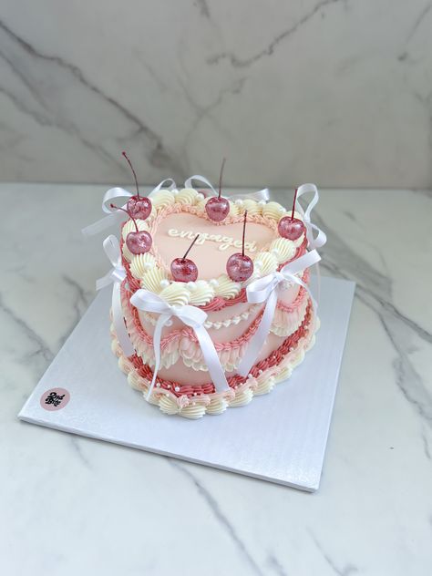 Coquette vintage heart cake with bows and pink glittter cherries Vintage Cake Cherries, Croquette Birthday Cake, Cute Vintage Cakes, Heart Shape Vintage Cake, Cherry Vintage Cake, Coquette Heart Cake, Vintage Cake With Bows, Heart Cake With Bows, Birthday Cake With Bows