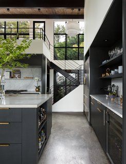 A 1957 Midcentury in Seattle Receives a Striking Makeover - Photo 4 of 16 - Here is a look back toward the stairwell and entryway. The wood ceiling adds warmth to the black and white scheme. Modern Renovation, Decor Ikea, Black Cabinets, Trendy Kitchen, Counter Tops, Black Kitchens, Wine Cellar, Design Case, Interior Paint