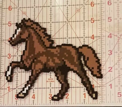 Galloping horse made out of perler beads. Horse Hama Beads, Perler Beads Horse, Country Perler Bead Patterns, Horse Perler Beads, Horse Pixel Art, Pixel Horse, Melt Beads Patterns, Perler Creations, Galloping Horse