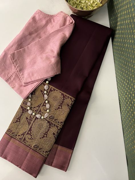 A truly one of a kind Trayi in a kaapi brown colour. This exquisite pure kanchipuram silk saree has a contrast edge border with double stacked majestic annam motifs in kattams along the bottom border. The pallu is in a beautiful dusty pink with rich pure zari work and comes with a contrast blouse. We may have outdone ourselves in the uniqueness quotient on this one. Be rest assured, clad in this, you will truly embody the distinctive essence within you. Contrast Colour For Pink Saree, Onion Colour Saree With Contrast Blouse, Onion Pink Saree Combination, Brown Saree With Contrast Blouse, Beige Saree With Contrast Blouse, Mauve Saree Contrast Blouse, Dusty Pink Saree, Onion Color Saree, Unique Kanchipuram Silk Saree