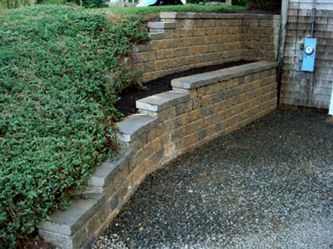 Segmental Retaining Walls After 1 | Mike Stacy Landscaping Retaining Wall With Flower Bed, Tiered Garden Ideas Sloped Yard Retaining Walls, Retaining Wall Under Deck, Walk Out Basement Retaining Wall Ideas, Tall Retaining Wall Ideas, Basement Retaining Wall Ideas, Walk Out Basement Landscaping, House Retaining Wall, Walkout Basement Landscaping