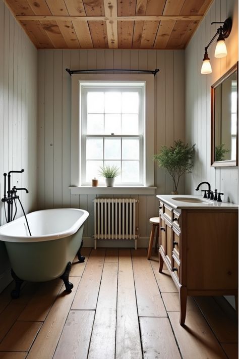 Rustic bathroom with wood-look waterproof ceramic tile flooring, clawfoot tub, and vintage vanity Wooden Floors In Bathroom, Hardwood Bathroom Floor, Cottage Bathroom Flooring Ideas, Floorboards Bathroom, Easy Bathroom Flooring, Wood Floor In Bathroom, Bathroom With Wooden Floor, Farmhouse Bathroom Flooring Ideas, Wood Floors Bathroom