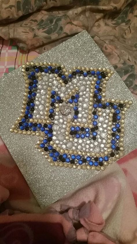 My graduation cap :) Go Marquette! Grad Cap Ideas College Logo, Graduation Cap Designs Hannah Montana, Sport Management Graduation Caps, Michigan Grad Cap, University Of Tampa Graduation Cap, Marquette University, Eastern Michigan, University Graduation, University Of Mississippi