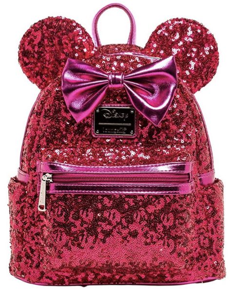 Material: Faux Leather Measurements: W 9" x H 10.5" x D 4.5" Wipe clean Leave a little sparkle wherever you go with this adorable 707 Street Exclusive Loungefly Disney Minnie Mouse mini backpack! This faux leather bag shimmers in magenta sequins and is topped with mouse ears and Minnie's iconic bow. This bag also features multiple storage compartments, two side pockets and adjustable straps. Minnie Mouse Backpack, Sequin Backpack, Disney Outfit, Mini Mochila, Pink Minnie, Loungefly Bag, Faux Leather Bag, Loungefly Disney, Cute Backpacks