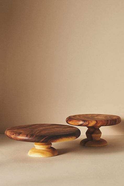 This wooden cake stand features hardcarved details that showcase the natural wood grain for a dash of rustic elegance. | Carolina Cake Stand by Anthropologie, Size: Small Wood Plates Ideas, Small Wood Turning Projects, Cake Stand Wooden, Wooden Plates And Bowls, Rustic Wooden Signs, Wooden Cake Stand, Cake Stand Decor, Rustic Cake Stands, Wooden Cake Stands