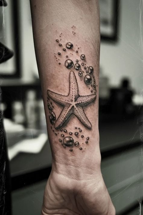 Starfish tattoo with bubbles on a person's forearm. Ocean Lover Tattoo, Tattoo For Parents, Beach Theme Tattoos, Small Wrist Tattoo Ideas, Women Tattoo Inspiration, Ocean Theme Tattoos, Small Wrist Tattoo, Tattoo Ideas For Females, Lover Tattoo