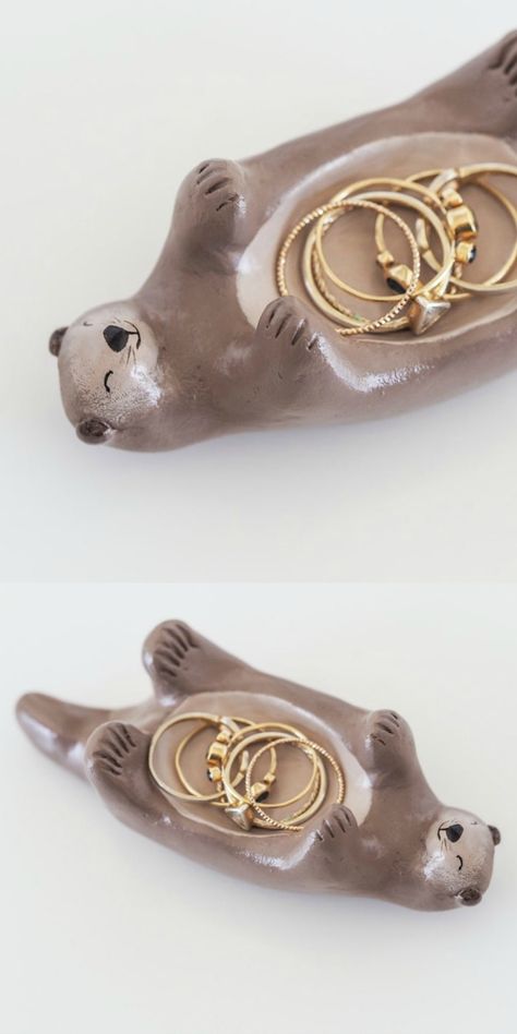 A hand painted otter jewelry holder by Paint My Dream. Otter Ring Holder, Otter Clay Dish, Clay Projects Jewelry Holder, Cute Ring Holders Clay, Pottery Painting Jewelry Holder, Air Clay Ring Holder, Air Dry Clay Ring Holder Diy, Clay For Jewelry Holder, Ceramic Art Jewelry Holder