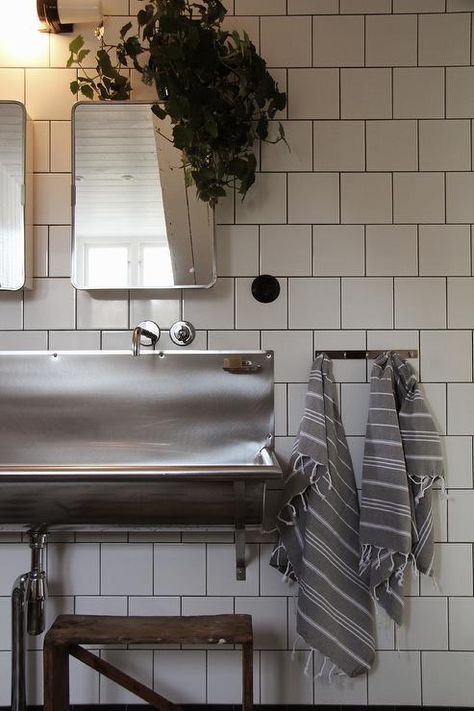 Industrial kids' bathroom features a step stool under a stainless steel trough sink and curved stainless steel medicine cabinets and mirrors next to a stainless steel hook draped in gray Turkish hand towels. Industrial Sink Bathroom, Rustic Kids Bathroom, Trough Sink Bathroom, Sink Backsplash, Stainless Steel Bathroom Sink, Industrial Bathroom Design, Kids Bathroom Design, Stainless Steel Farmhouse Sink, Metal Sink