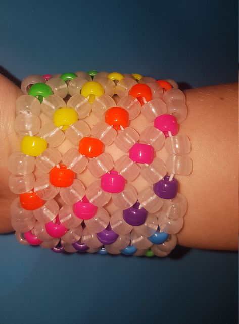 Glow in the dark rainbow Kandi  cuff  made with pony beads and stretch cord made with the x base stitch cuff  Shipping please note I am UK based - It should take 3-7 days in the UK I ship first class Royal mail For international orders it can take 7 days to 4 weeks depending on where you are located please let me know if you have a deadline date. Rainbow Kandi Cuff, X Base Cuff, Kandi Cuff Ideas, Rave Kandi Ideas, Rainbow Kandi, Bracelets Kandi, Scene Kandi, Pulseras Kandi, Kandi Cuff Patterns