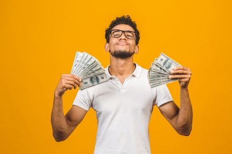 Young rich african american man in casua... | Premium Photo #Freepik #photo #money #man #hipster #shirt Holding Money Pose, Thumbnail Poses, Man With Money, Men With Money, Photo Money, Formal Poses, Thinking Pose, Rich Person, Holding Money