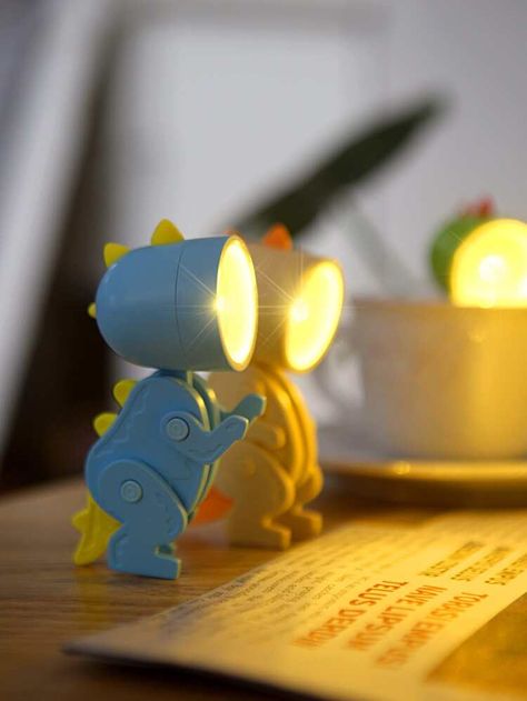 1pc Cartoon Dinosaur Shaped Random Color Night Light, Small Cute Plastic Decorative Light For Home Decor | SHEIN USA Dinosaur Night Light, Dinosaur Lamp, Bedroom Bliss, Book Lights, Cartoon Dinosaur, Inspired Living, Small Light, Boho Bedroom, Random Color