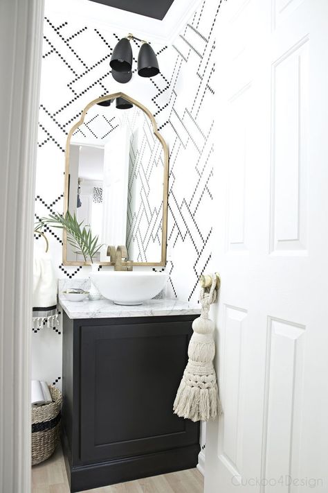 black and white stenciled powder room with black cabinet, white vessel sink, marble counter and gold accents Black And White Powder Room, White Powder Room, Gold Arch Mirror, Makeover Kamar Mandi, White Vessel Sink, Styl Hampton, Powder Room Design, Arched Mirror, Vintage Fans