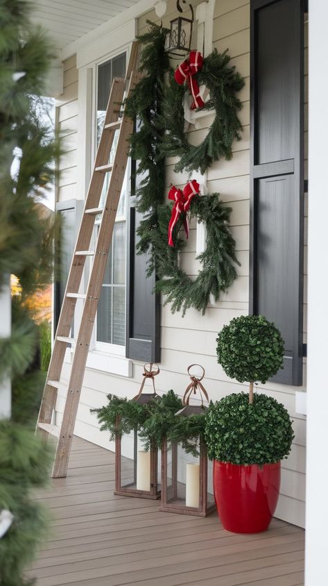 Elevate your home's curb appeal with these 18 elegant Christmas front porch designs. Featuring sophisticated garlands, stylish lanterns, classic topiaries, and refined seasonal accents, these ideas help you create a polished, festive look. Perfect for adding timeless beauty and charm to your entrance this holiday season! Porch Topiary Ideas, Front Porch Topiary Ideas, Front Porch Topiary, Porch Topiary, Topiary Ideas, Front Porch Design, Christmas Accents, Christmas Front Porch, Christmas Porch Decor