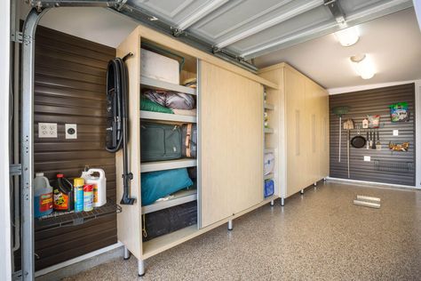 On another side of the garage is a large-sized rectangular maple melamine cabinet with full sliding doors allowing for easy access to belongings whenever the car is parked inside. Storage Ideas For Garage, Garage Storage Units, Build Garage, Garage Organization Shelves, Shed Shelving, Ideas For Garage, Cabinet With Sliding Doors, Closet Factory, Garage Storage Cabinet