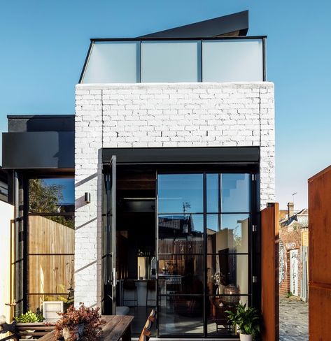 This renovation and extension to a narrow single fronted terrace house was the beginning of a family’s unconventional move from suburbia to inner city Fitzroy. Our clients sought to create an edgy yet comfortable urban home for themselves and their two grown up children. Upside Down House, Painted Brick Walls, Victorian Terrace House, Recycle Timber, Timber Beams, Brick Veneer, Victorian Terrace, Painted Brick, Australian Homes