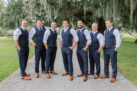 Groom and groomsmen pose for pictures before charming southern wedding. Love their cognac shoes and blue pants and vests! Check out the rest of the wedding at thebridalfinery.com. Blue and tan menswear // mens wedding fashion // groomsmen ideas // groomsmen outfits Groomsmen Just Vests, Vest Only Groomsmen, Groomsmen With Vests Only, Open Collar Groomsmen, Groomsmen Vest And Bowtie, Navy Vest Outfit Mens, Navy Blue Vest Groomsmen, Groomsman Outfit Ideas, Groomsmen Vest Attire