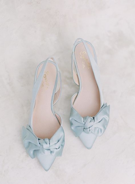 Are you a bride in search of the perfect wedding heels? Check out our blog post on these must-see designer heels of all price ranges and designer brands from Kate Spade to Jimmy Choo. Click here now to see our favorites! #wedding #shoes #heels #designershoes #weddingday #photographer #planner #bridalstyle #fineart Kate Whitcomb Wedding Shoes, Bridal Blue Shoes, Bride Shoes Wedding Heels Elegant, Blue Satin Wedding Shoes, Coloured Bridal Shoes, Timeless Wedding Shoes, Blue Wedding Shoes Flats, Wedding Shoes Colorful, Wedding Dress With Blue Shoes