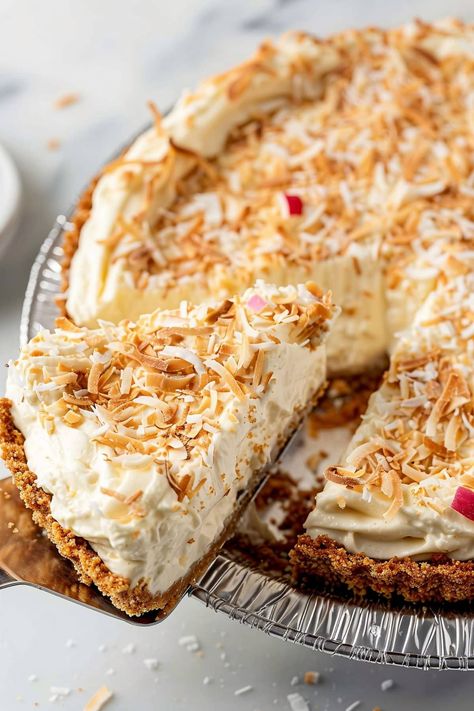 This luscious piña colada cream pie combines the tropical flavors of coconut, pineapple, and rum in a cool and creamy filling. The buttery graham cracker crust provides the perfect crunchy contrast. Tropical Cream Pie, Pina Colada Pie Recipe, Pina Colada Pie, Almond Joy Cake, Pineapple Pie, Cream Pies, Coconut Pie, Cracker Crust, Refreshing Desserts