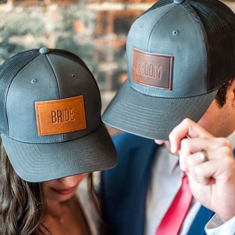 Bride and Groom hats, anyone?! 👰🏻🤵🏼While we may not necessarily *suggest* walking down the aisle in these, we certainly wouldn’t stop you! 😜 And they’re perfect for honeymooners or the bachelor and bachelorette parties leading up to the big day! 🎉🎉🎉⁣ ⁣ #weddinggifts #bacheloretteparty #bachelorparty #rusticweddings #wedding #weddingday #weddinginspiration #weddingideas #weddedbliss #ido ⁣ #truckerhatcustom #truckerhat #truckerhats #customhat #leatherhat #hat #hats #hataddict #leathergift Groom Hats, Western Themed Wedding, Patch Hats, Country Theme Wedding, Personalized Hats, Country Theme, Horween Leather, Wedding Activities, Personalized Bride