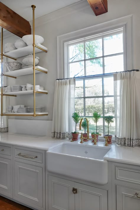 White kitchen with open shelving right next to the window Kitchen Window Decor Over Sink, Shelf Over Window, Rustic Farmhouse Kitchen Ideas, Kitchen Window Shelves, Temporary Kitchen, Kitchen With Open Shelving, Kitchen Window Ideas, Window Over Sink, Kitchen Window Decor