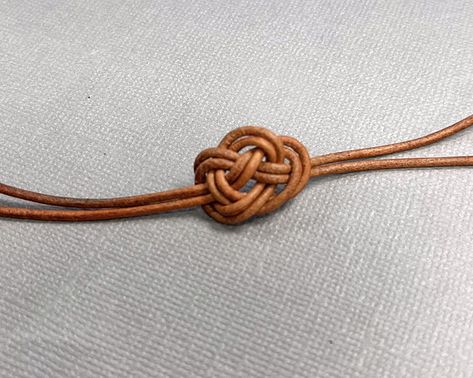 Knotted Leather Bracelet (Project Idea) Knotted Leather Bracelet Diy, Leather Knots, Leather Cord Jewelry Diy, Round Leather Cord Bracelet Diy, Leather Braiding Techniques, Braid Leather Diy, Cord Jewelry Diy, Braided Leather Bracelet Diy, Adjustable Brown Leather Braided Bracelet