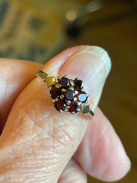 VINTAGE Victorian design Rich deep Red Genuine Garnet Cluster Ring probably from the 70's  Size 6 3/4 and easily sizable  Hallmarked 9k  7 genuine Garnets approx. 3.25mm  Note the diamond shaped side detailing on each side of the cluster EXCELLENT SHAPE GARNET is a stone of regeneration and energizing it can boost energy. It is said to be stabilizing in that it can bring order to chaos whether internal or external. Antique box not included...shipped in a new velvet box FREE SHIPPING Vintage Garnet Ring, Maximalist Jewelry, Wedding Plan, Future Wedding Plans, Victorian Design, Garnet Jewelry, Antique Boxes, Antique Design, Vintage Victorian