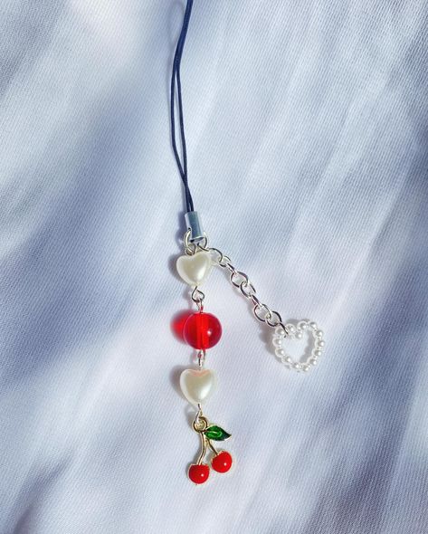 CHERRY BRACELET/ PHONE CHARM🤍 Full set : ₹150/- (Excluding shipping charges) Bracelet : ₹99/- (Excluding shipping charges) Phone charm : ₹60 (Excluding shipping charges) CUSTOMIZATION OF BEADS CAN BE DONE CAN BE MADE AS A KEYCHAIN TOO!! SHIPPING : All over India. Feel free to dm if any queries! #accessories #phoneaccessories #phonecharms #phonecharmindia #earrings #bracelets #keychaincustom #customisation #goodquality #asthetic #giftforhim #giftforher Diy Bag Charm, Cherry Bracelet, Diy Jewelry Charms, Phone Charms, Diy Charms, Phone Charm, Diy Bag, Charm Jewelry, Full Set