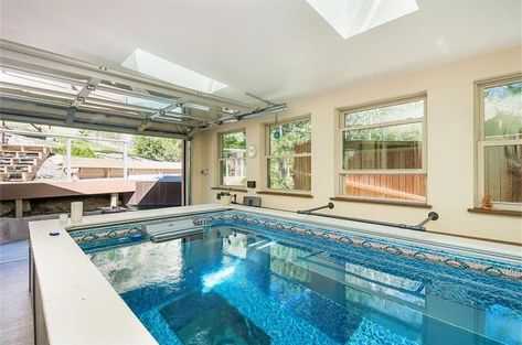 Are you getting the most out of your garage? This Endless Pool lets you swim in place (think of it as a swimmer's treadmill) in your own garage gym! Garage Pool House, Endless Pools, Indoor Pool House, Hot Tub Room, Indoor Pool Design, Pool Images, Endless Pool, Spa Rooms, Basement Pool