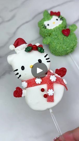 137K views · 8.3K reactions | Snowman Hello Kitty marshmallow pop ☃️🎀 Watch until the end for a surprise Hello Kitty pop. Do you want to see how I made her too? 💚♥️ To make these I used @campfiremarshmallows dipped in a blend of @stoverandcompany sweet shoppe ultra white and eleven o one deluxe melting wafers. I added their artisan accents chocolate chameleon candy color in white to make it bright white. I used a sour belt for the scarf and a mold for the bow and hat. 

#hellokitty #hellokittycore #hellokittycafe #hellokittyandfriends #sanrio #hellokittychristmas #christmas #christmastreats #christmasbaking #christmasideas #christmasparty #marshmallow #chocolatecoveredmarshmallows #marshmallowpops #marshmallows #christmasinspiration #christmasinspo #holiday #holidays #holidayseason #holi Hello Kitty Marshmallow, Hello Kitty Pop, Christmas Candy Easy, Xmas Desserts, Christmas Food Treats, Xmas Treats, Chocolate Covered Marshmallows, Christmas Cake Pops, Marshmallow Treats