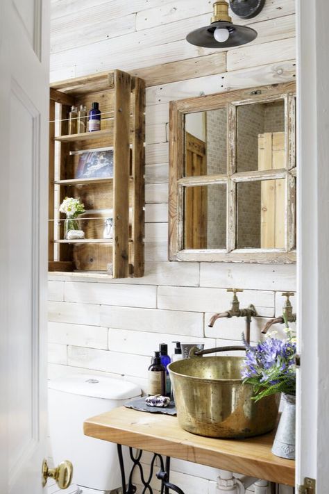 Compromises do have to be made in small spaces, but it is possible to contain all of the necessary bathroom features – your sink, mirror, storage etc. – if you're willing to miniaturise. This clever shelving unit started life as an apple crate, whilst the tiny mirror hides some modest shelves. Bathroom Decor Ideas Blue, Rustic Small Bathroom Ideas, Statement Bathroom, Mirror Cupboard, Apothecary Bathroom, Blue Bathroom Decor, Bathroom Layouts, Renovation Tips, Classic Bathroom