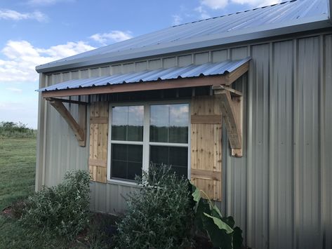 Cedar shutters and awning on a barndominium Shutters On Barndominium, Shutters And Awnings Together, Barndominium Window Awnings, Window Awnings Exterior Farmhouse Metal, Barndominium With Shutters, Awning And Shutters, Rustic Awnings For Windows, Awning For Mobile Home, Outside Window Awnings