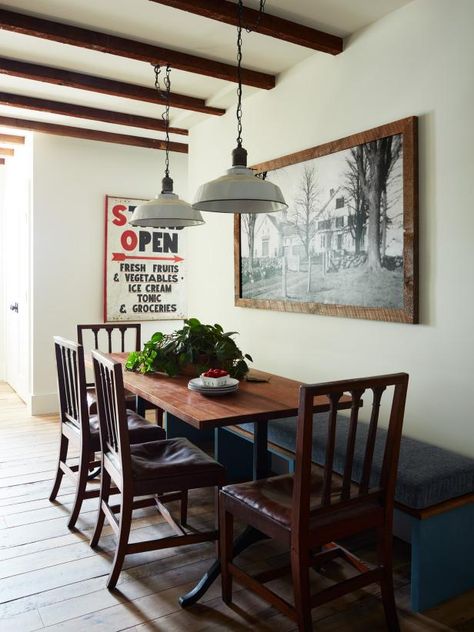 Neutral colors on the walls and light fixtures allow the space's wood features — such as ceiling beams and the dining table and chairs — to stand out. Large-scale, black-and-white art completes the simple-hued palette. Farmhouse Fixer Hgtv, Stone Cabinets, Kristina Crestin, Farmhouse Home Design, Exposed Beams Ceiling, Farmhouse Fixer, Ceiling Details, Exterior Color Palette, Jonathan Knight