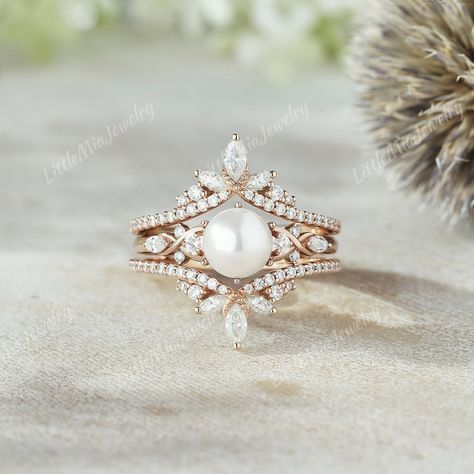 Vintage Akoya Pearl Engagement Ring Set Solid Gold Marquise Moissanite Double Curved Wedding Band Promise Bridal Rings For Women Anniversary Gift If you want to see more pictures of enhancer ring, you can click on the links below: https://www.etsy.com/listing/1527995004 ◆RING DETAILS: ❃Engagement ring: Centre Stone: Akoya Pearl Size: 6.mm Side stone: Round cut : Moissanite Marquise cut:  Moissanite Weight - 0.162ct Clarity - SI-VS Color- G-H ❃Band Width:1.7mm ❃Wedding band: Round cut : Moissanite Marquise cut: Moissanite Weight - 0.556t Clarity - SI-VS Color- G-H Band Width: 4.4mm ◆All ring sizes are available, If you can't find your ring size in the list, please feel free to contact me. ◆Metal Options. Available in Sterling silver and 10k/14k/18k yellow gold, white gold, and rose gold.  ◆ Pearl Engagement Ring Set, Gold Moissanite Ring, Pearl Rings Vintage, Rose Gold Moissanite Ring, Enhancer Ring, Unusual Engagement Rings, Anniversary Ring Set, Ring Enhancer, Promise Ring Set